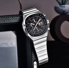 Pagani Design PD-1819 black dial chronograph propped on a shelf beside a picture frame