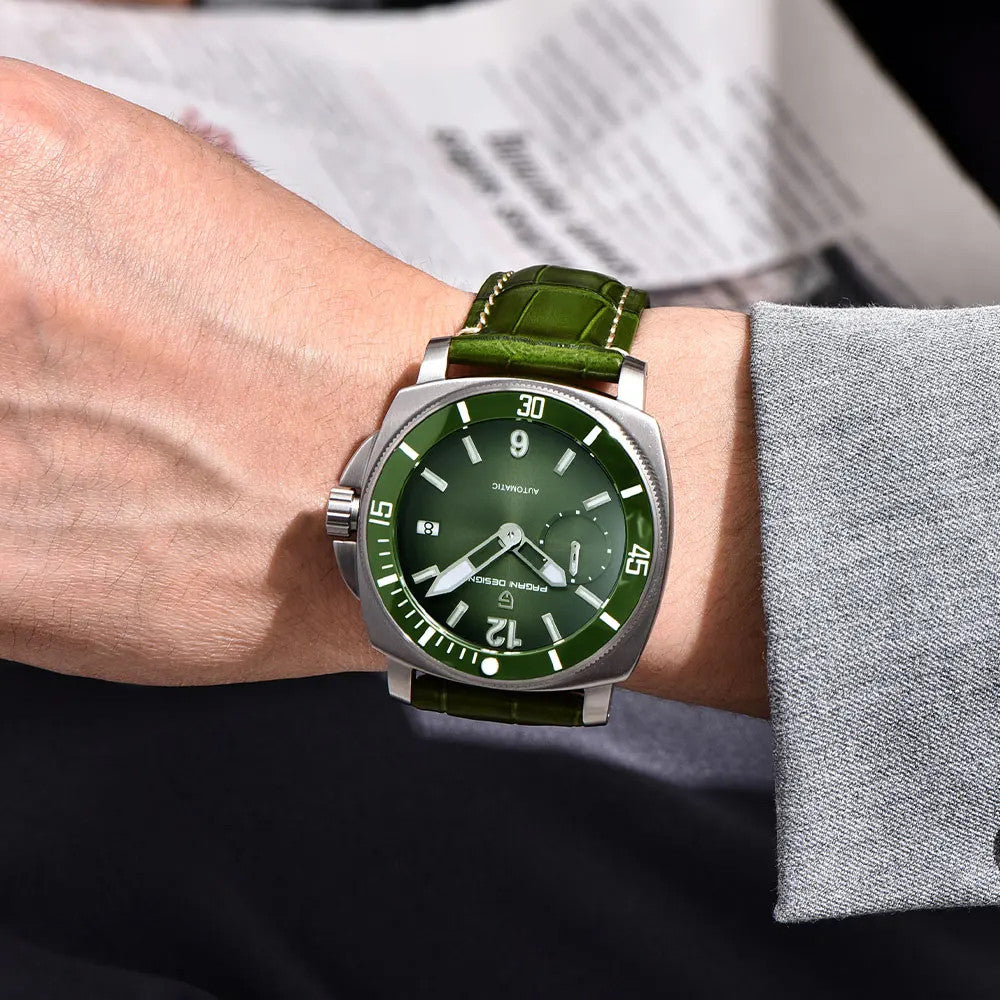 PAGANI DESIGN PD-1820 automatic watch with green dial worn on wrist over newspaper