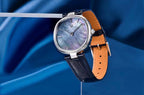 Pagani Design PD-1825 blue mother-of-pearl dial at an angle with blue strap and tan lining