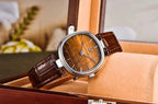 Pagani Design PD-1825 tiger's eye dial displayed inside a wooden glass-top watch case