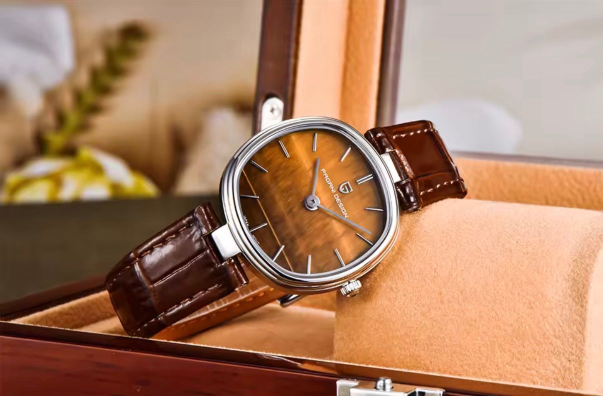Pagani Design PD-1825 tiger's eye dial displayed inside a wooden glass-top watch case