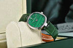 Pagani Design PD-1825 green malachite dial resting on the pillow of its original gift box
