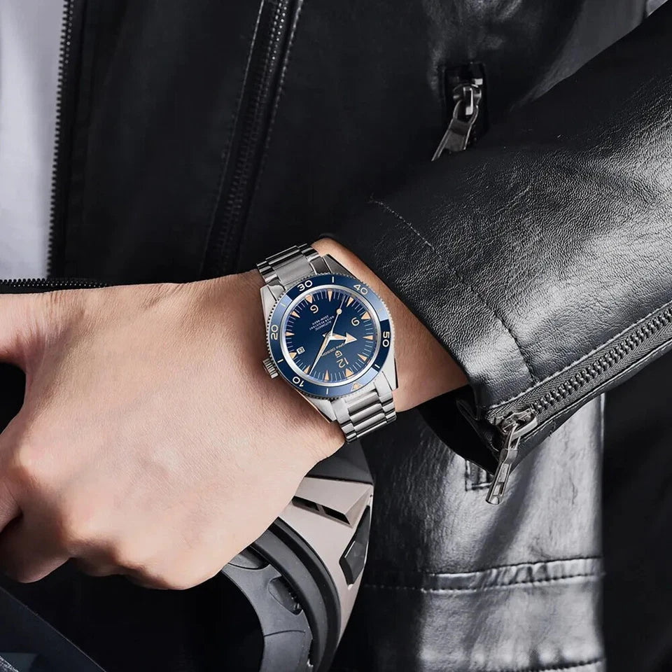 PAGANI DESIGN PD-YS005 automatic watch with blue dial silver bracelet worn on wrist with leather jacket