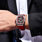 Man wearing PAGANI DESIGN PD-YS011 skeleton chronograph watch with red strap and suit jacket