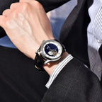 Man wearing PAGANI DESIGN PD-YS015 NH39 tourbillon watch with blue dial and black leather strap