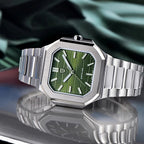 PAGANI DESIGN PD-YS019 slim watch with green dial and stainless steel bracelet on reflective surface