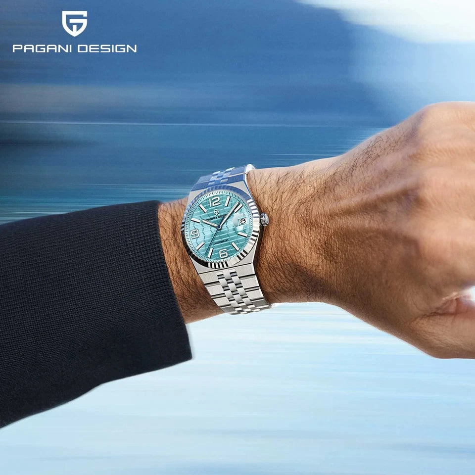Pagani Design PD-YS027 hand-wind watch teal textured dial stainless steel bracelet wrist shot blurred blue background