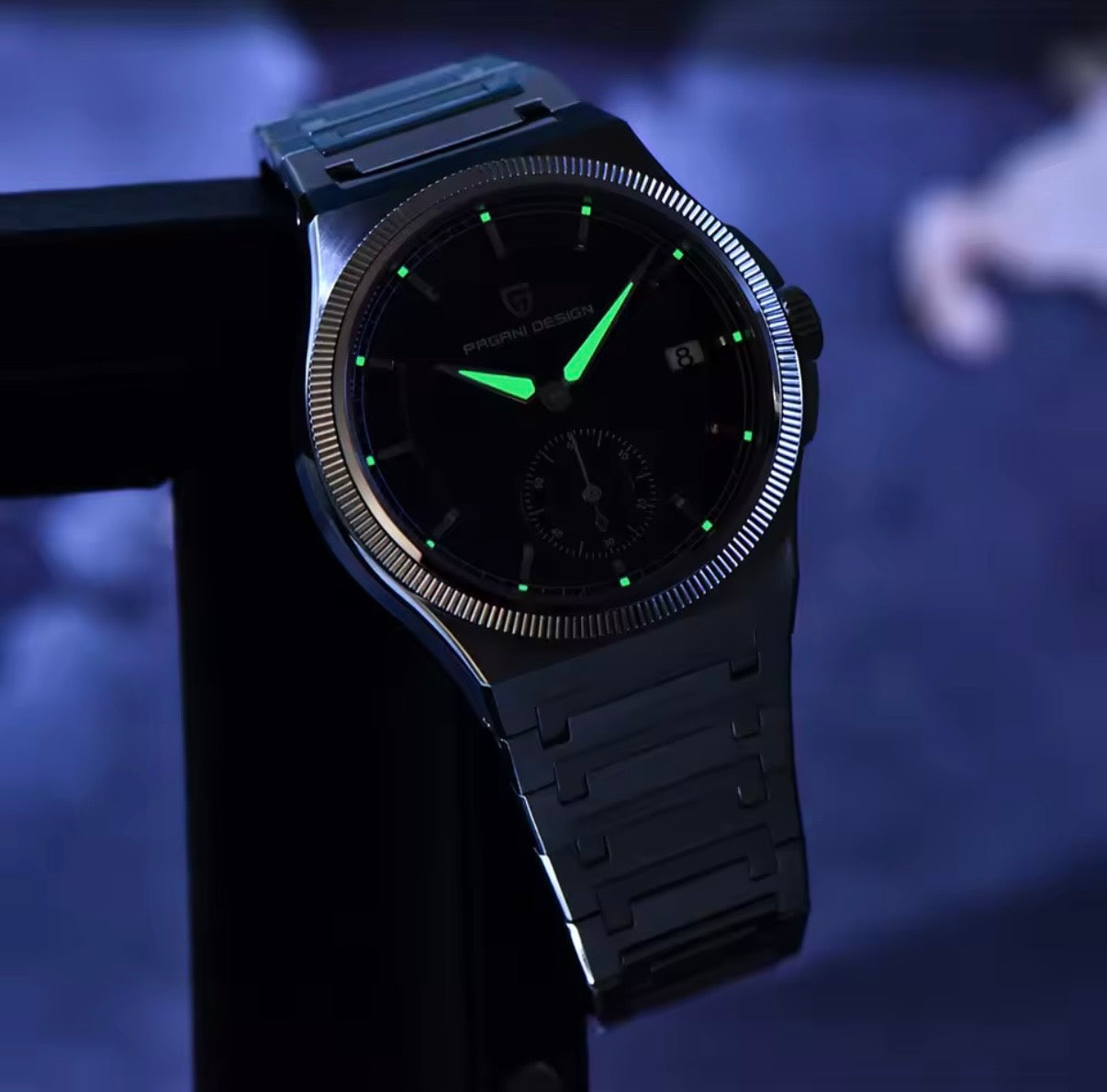 Pagani Design PD-YS029 42mm watch with green lume in low light, detail view