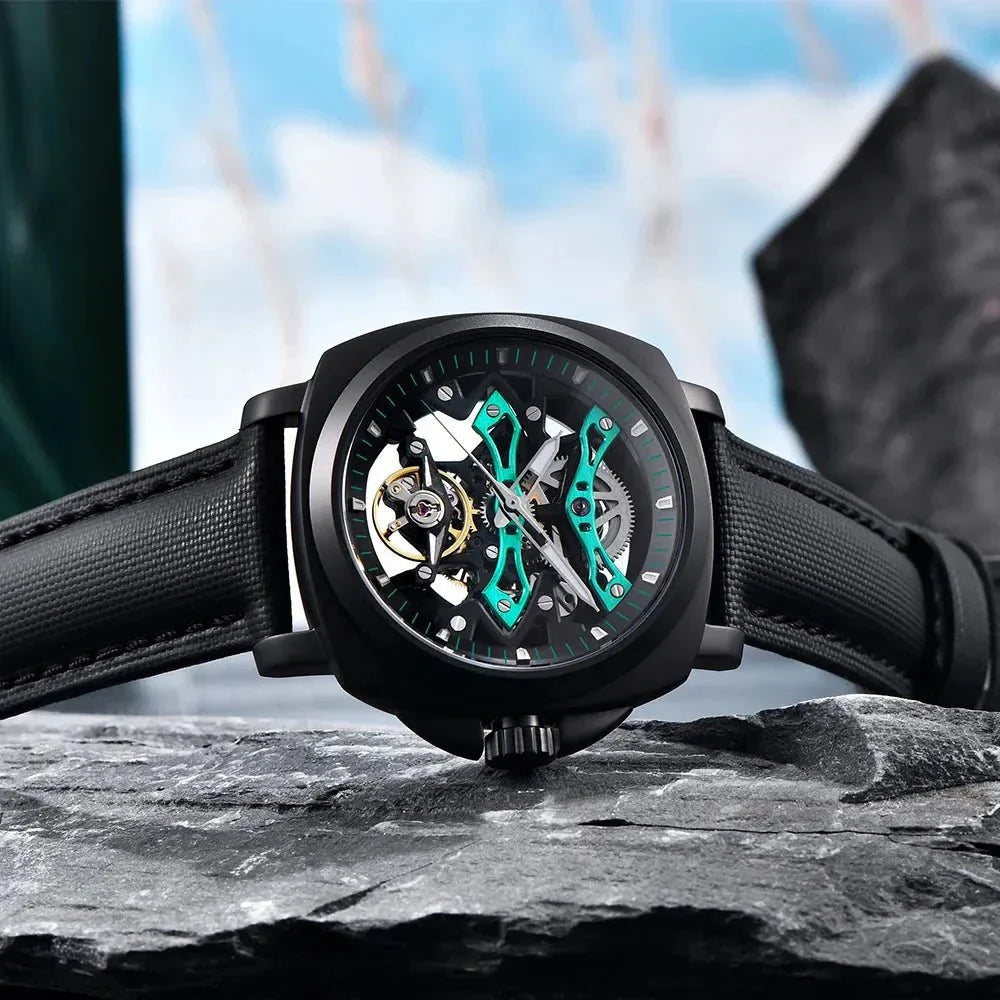 Pagani Design PD-YS017 green skeleton watch lying on stone, teal bridges and open balance