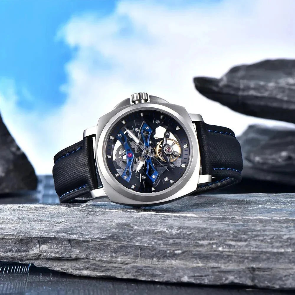 Pagani Design PD-YS017 blue tourbillon watch resting on slate, sapphire crystal and dial depth