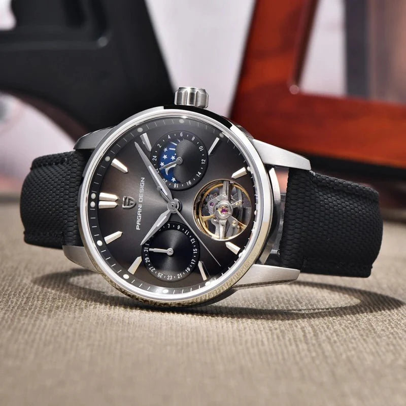 Pagani Design PD-YS021 silver black model angled on fabric, brushed steel case and lume indices