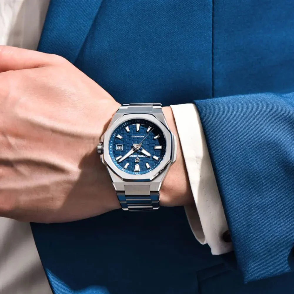 Pagani Design PD-YS023 blue textured dial worn on wrist with a blue suit sleeve