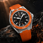 Pagani Design PD-YS034 beaded with water on wet rock, showing 100M resistance and orange rubber strap