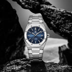 Pagani Design PD-1673 blue dial men's automatic watch displayed on rocks