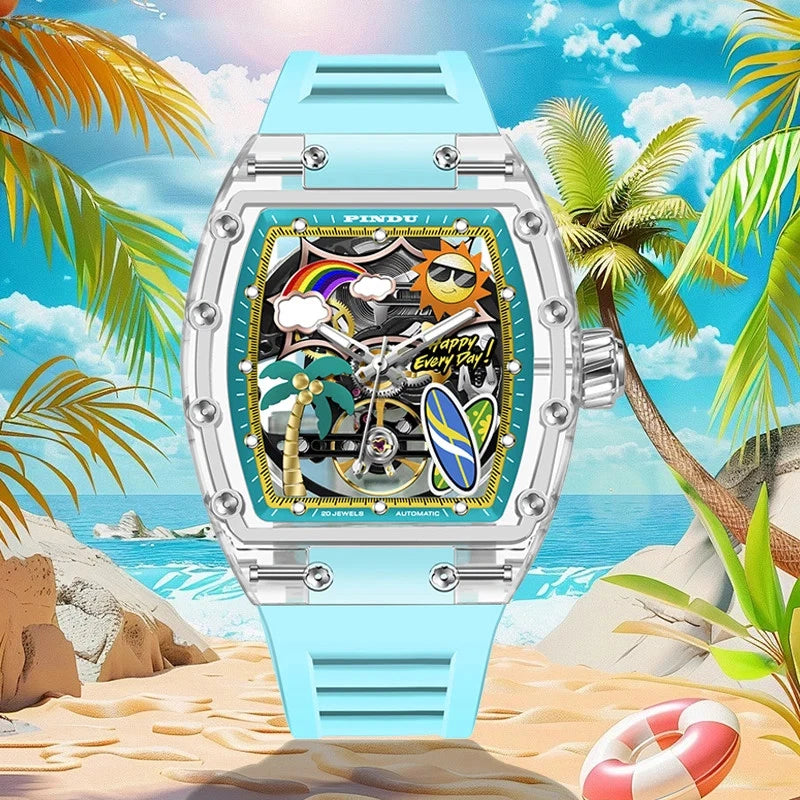 PINDU 6633 Summer Beach tonneau mechanical watch with skeleton tropical dial; transparent resin case; sky blue silicone strap; photographed on a sandy beach with palm trees and ocean; lifestyle photo.