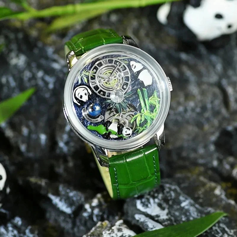Pindu M27 mechanical watch with rotating crystal ball and skeleton dial, stainless steel case and green leather strap, photographed outdoors on wet rock with foliage
