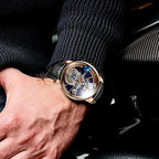 PINDU P5015 Celestial Tourbillon rose gold men's watch with blue dial worn on wrist in car interior