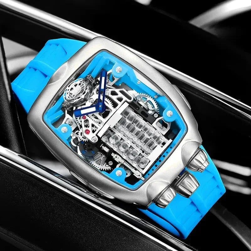 PINDU P5023 steel tonneau watch with cyan strap resting on a car wheel, engine skeleton dial
