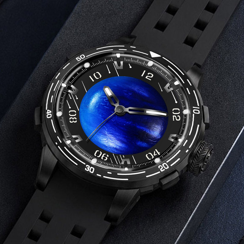 PINDU P6676 Planet blue domed dial in black 48mm case, laid flat on navy suede with black silicone strap curled behind