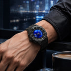 PINDU P6676 worn on a man's wrist at a night window with blurred city lights and a coffee cup beside him