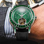 PINDU PD5037 tourbillon watch with green emerald dial worn on wrist with striped dress shirt