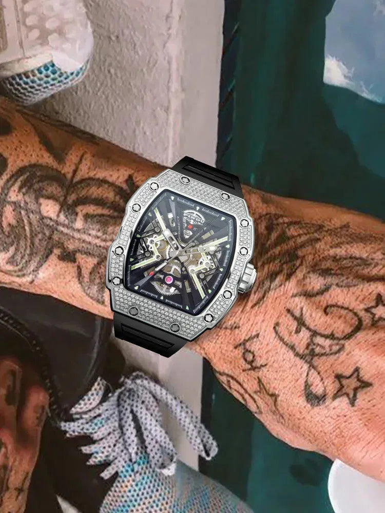 PINDU PD6550 men's tonneau skeleton watch with silver diamond bezel and black rubber strap on tattooed wrist
