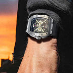 PINDU PD6550 Wine Barrel skeleton men's watch with black dial on wrist at sunset