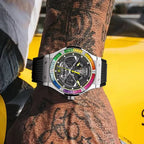 PINDU PD6552 colored diamond skeleton watch with rainbow bezel and black rubber strap on tattooed wrist