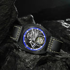 PINDU PD6568 black PVD blue-ring skeleton tourbillon on black leather, resting on dark rocks