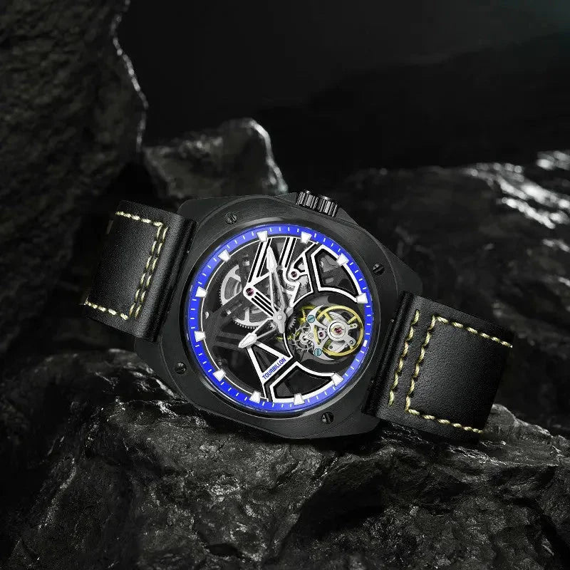 PINDU PD6568 black PVD blue-ring skeleton tourbillon on black leather, resting on dark rocks