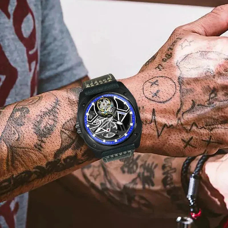 PINDU PD6568 black PVD blue-ring skeleton tourbillon worn on a tattooed wrist