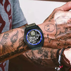 PINDU PD6568 black PVD blue-ring skeleton tourbillon worn on a tattooed wrist