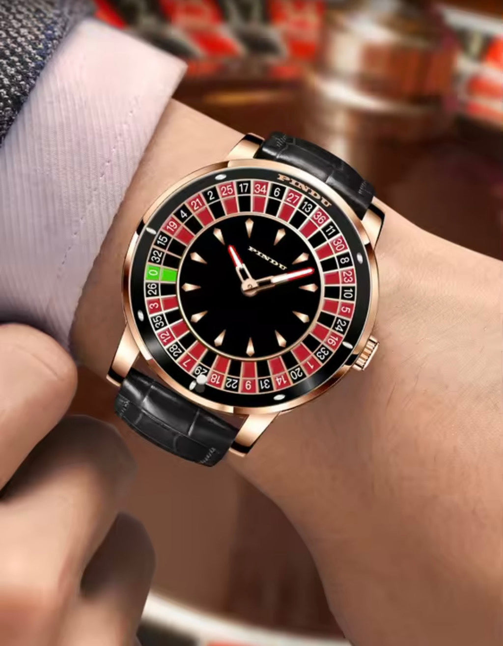 PINDU PD6617 worn on the wrist in a casino, rose gold case and black leather strap, black dial