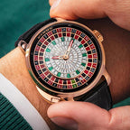 PINDU PD6628 roulette automatic watch with rose gold case, diamond dial and black leather strap held in hand