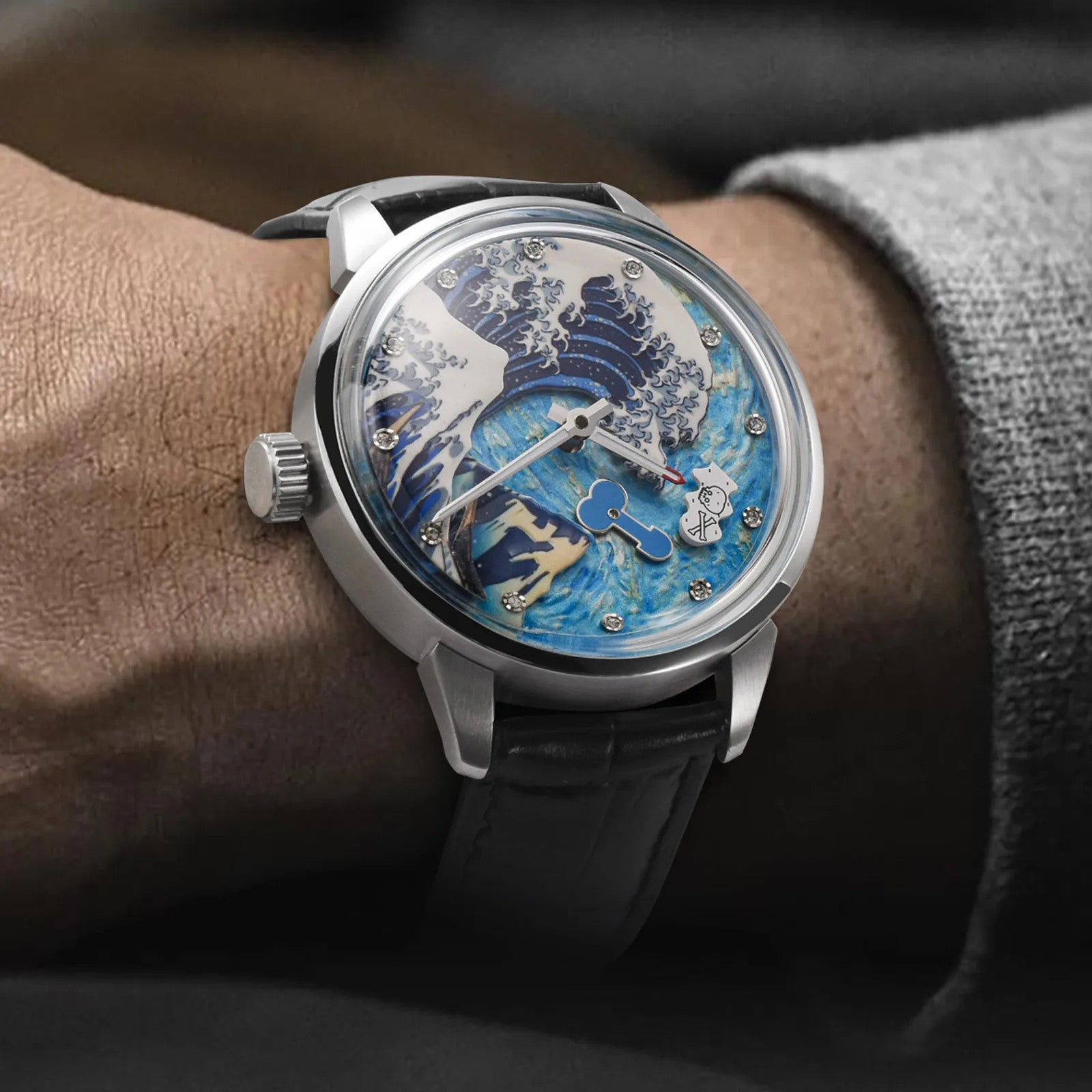 PINDU PD6668 Wave Dial watch with blue ocean dial on wrist with gray sweater