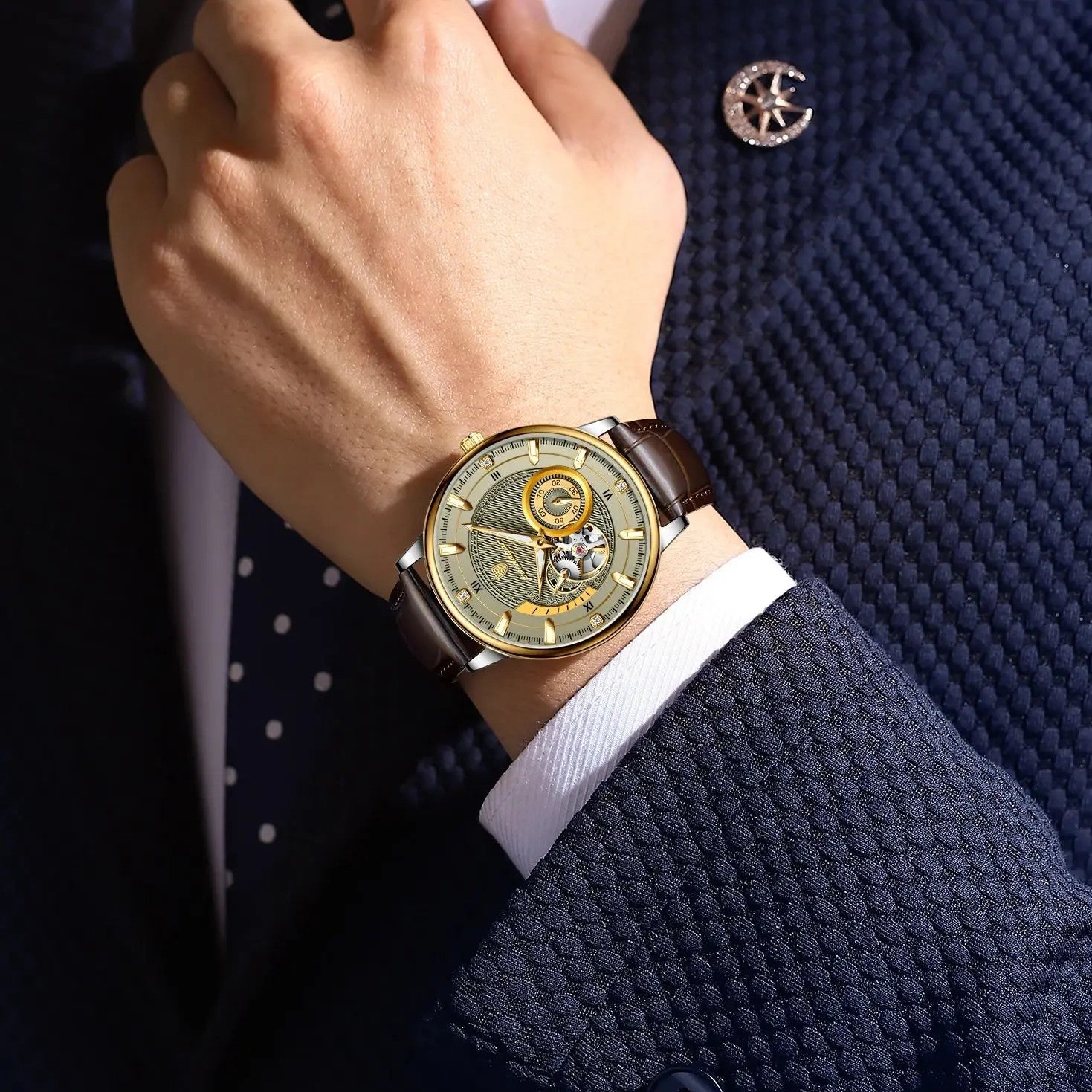 POEDAGAR 1416 mens tourbillon automatic watch with champagne skeleton dial and brown leather strap on wrist