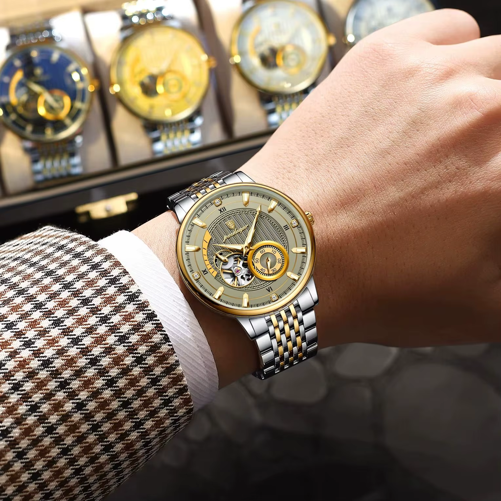 POEDAGAR 1416 automatic tourbillon watch with two-tone case and bracelet on wrist near display