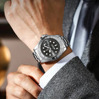 POEDAGAR 680S-2 mens quartz diver-style watch with black dial and silver steel bracelet on wrist