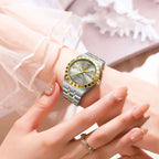 POEDAGAR 794 womens 31mm quartz watch with silver dial and two-tone steel bracelet on wrist