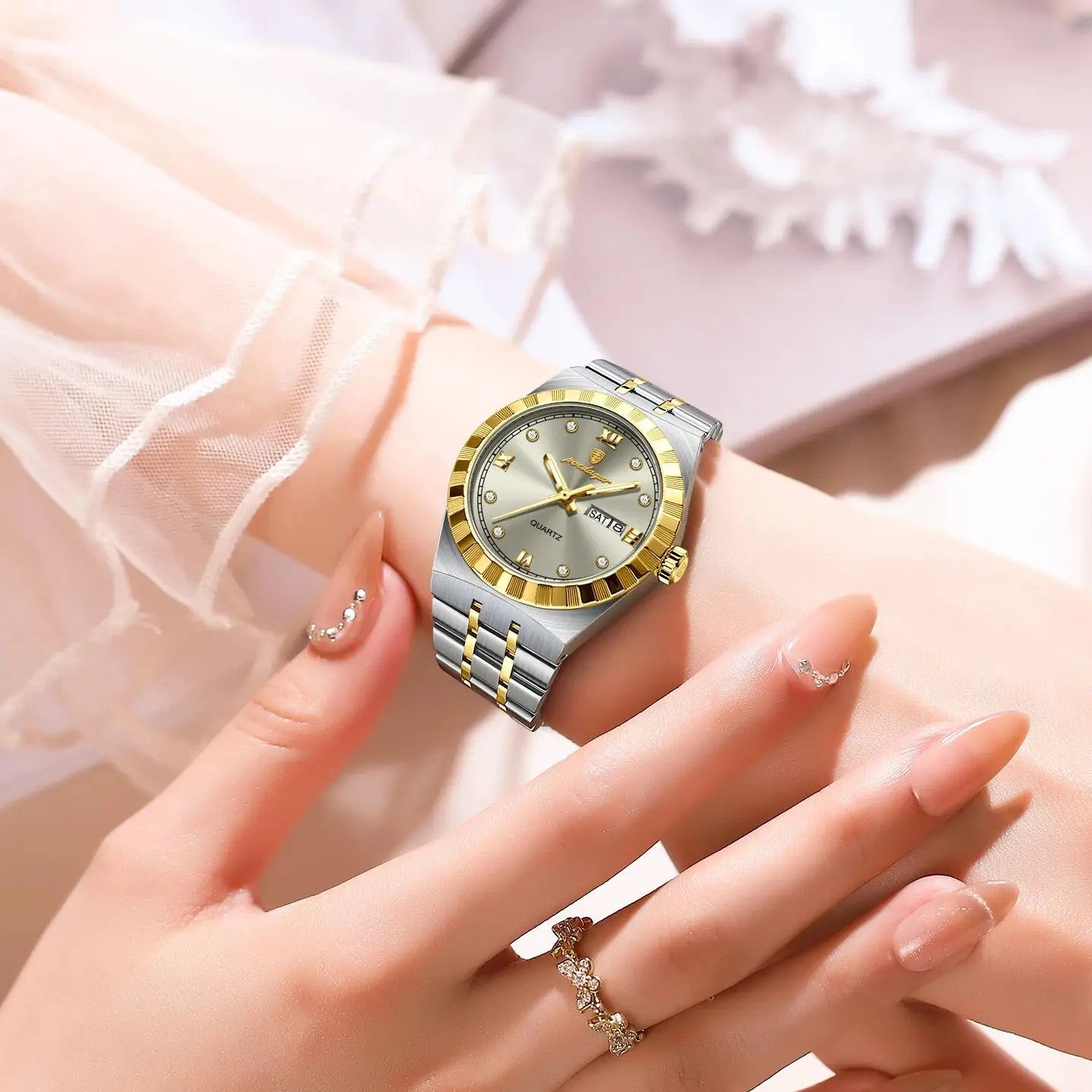 POEDAGAR 794 womens 31mm quartz watch with silver dial and two-tone steel bracelet on wrist