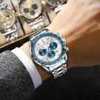 POEDAGAR 815-WH1 mens quartz chronograph with white dial blue tachymeter bezel and steel bracelet on wrist