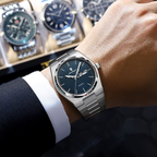 POEDAGAR 821S-1 mens quartz waterproof watch with blue textured dial and steel bracelet worn on wrist