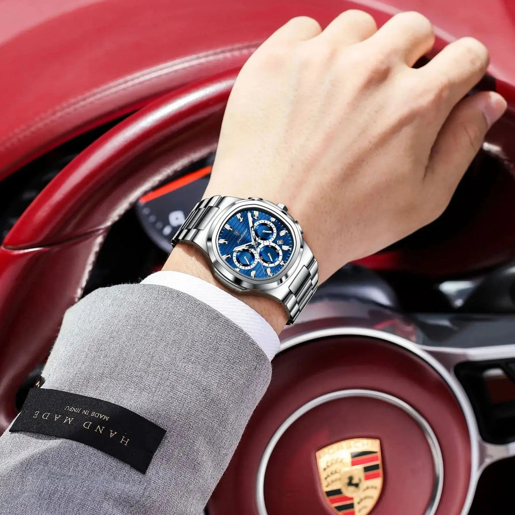 POEDAGAR 834 mens chronograph with blue dial and steel bracelet on wrist driving Porsche with HAND MADE label