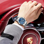 POEDAGAR 834 mens chronograph with blue dial and steel bracelet on wrist driving Porsche with HAND MADE label