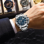 POEDAGAR 892 men's chronograph quartz watch with blue dial worn on wrist near watch display case