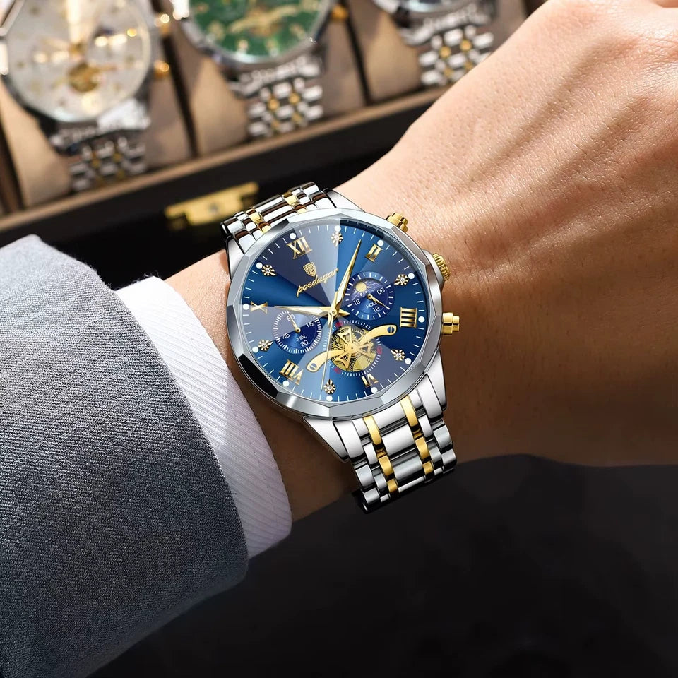 POEDAGAR 938 chronograph watch with blue dial and two-tone bracelet on wrist near watch display case