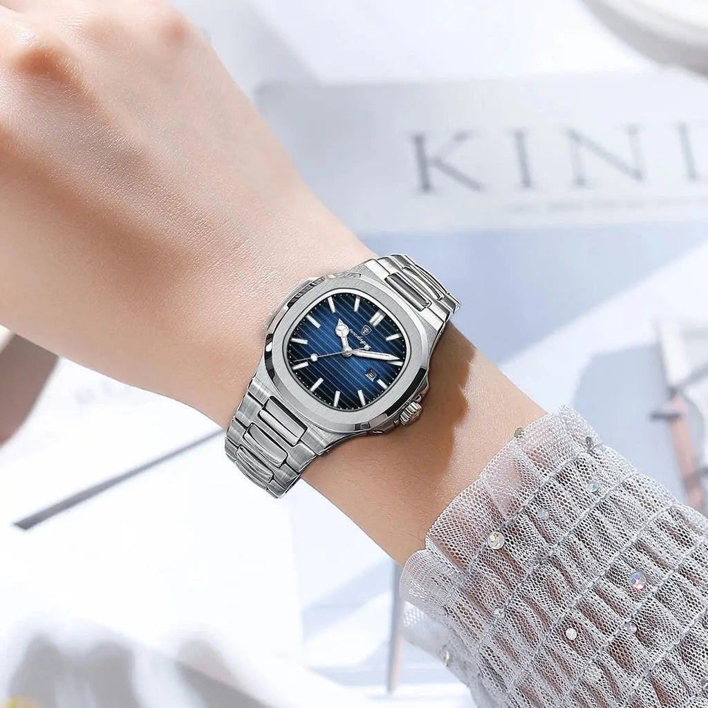 POEDAGAR women's quartz watch with blue dial and steel bracelet on wrist with sheer sleeve