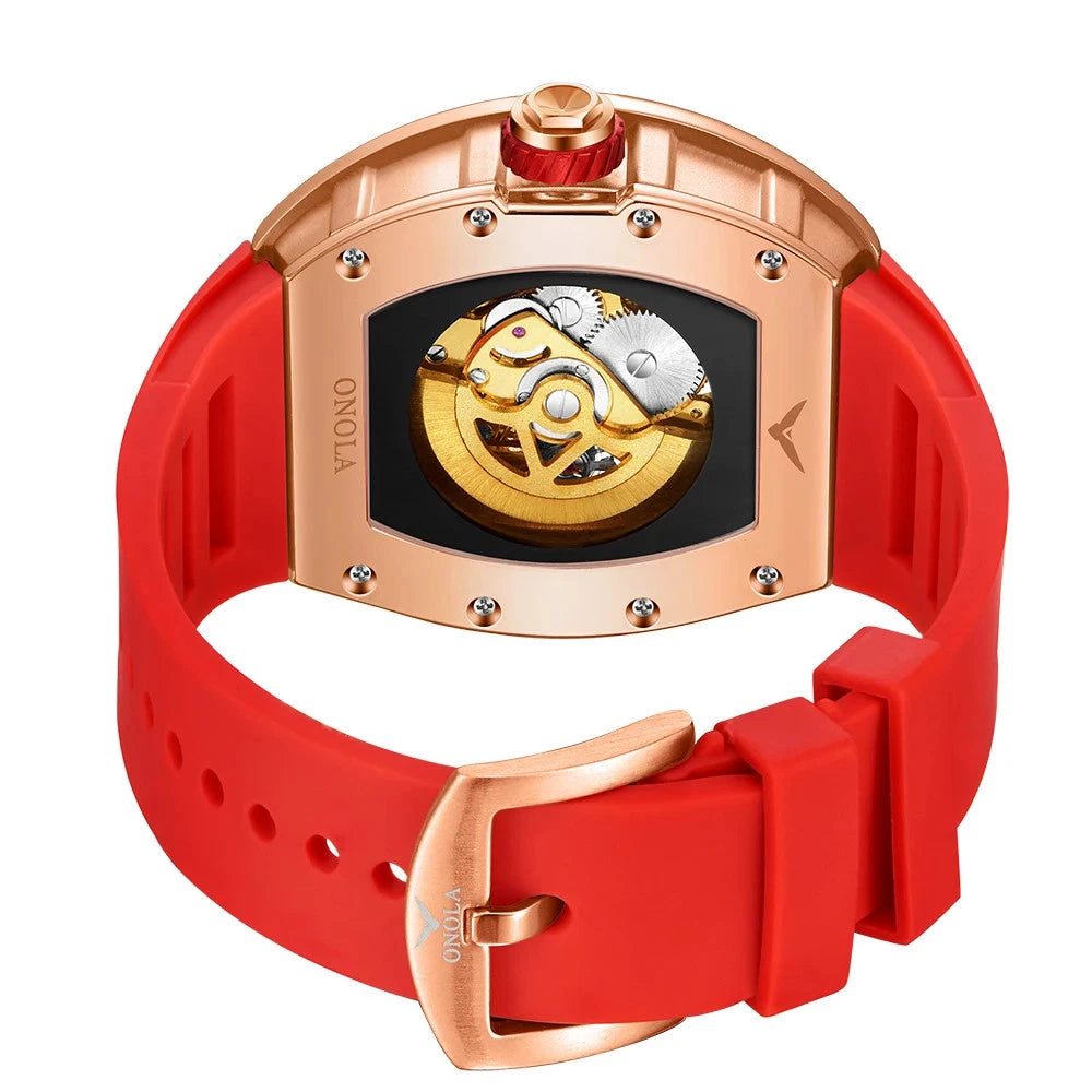 Watch with red strap and rose gold case on white background
