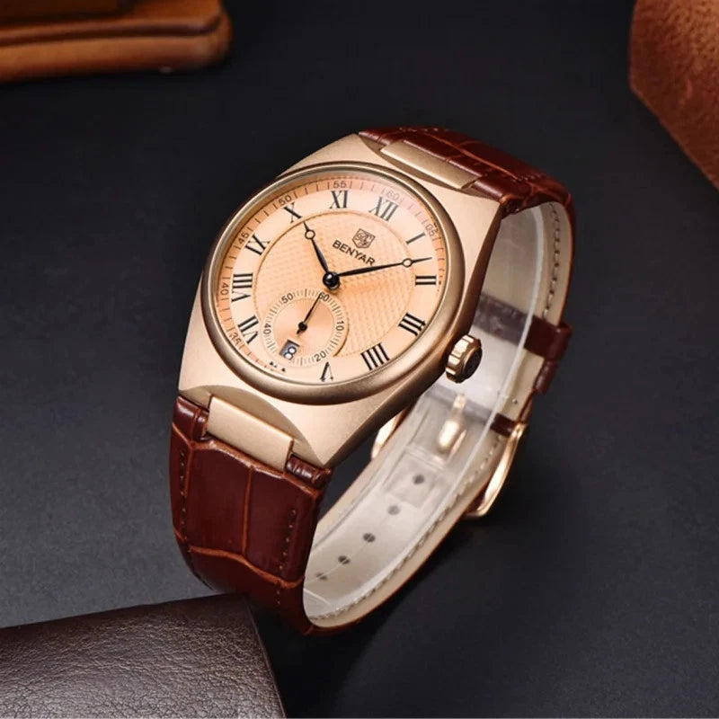 Rose gold watch with brown leather strap on a dark background