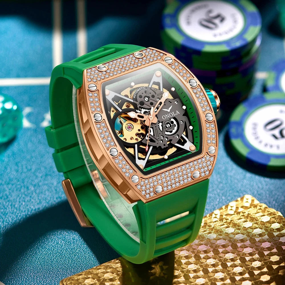 Green watch with rose gold case on a blue surface with poker chips